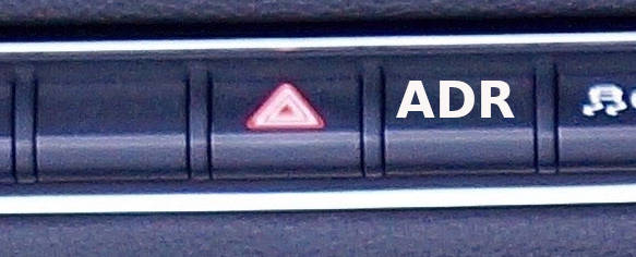 ADR Knopf im Bedienelement eines Fahrzeuges